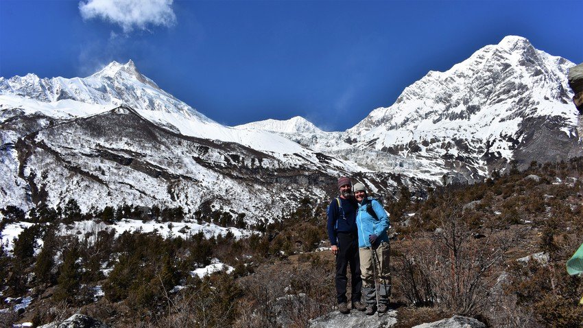 Mount Manaslu and trekkers on the way to Base Camp